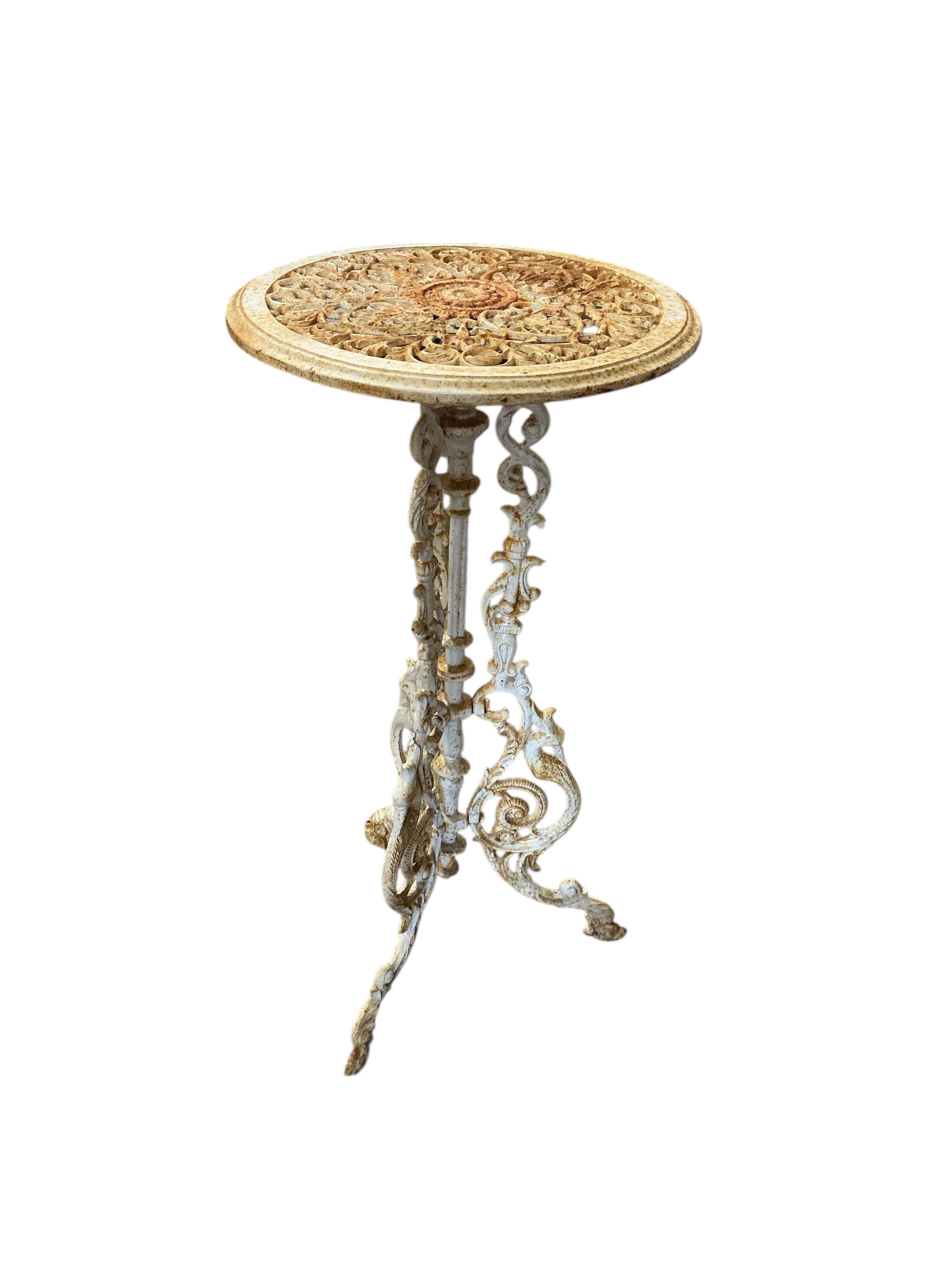 A pair of Victorian style circular painted cast iron stands, diameter 36cm, height 71cm